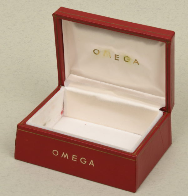 WAT0123 Omega red letherette box over wood, very good condition.