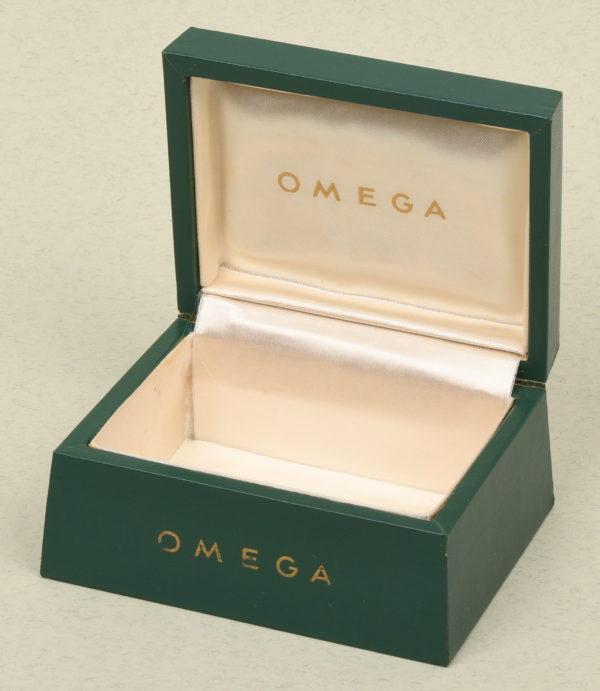 WAT0170 Omega green letherette box over wood, very good condition.